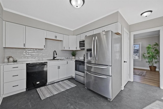 kitchen featuring sink, white cabinetry, backsplash, crown molding, and appliances with stainless steel finishes