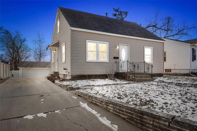 view of front of property with an outbuilding and a garage