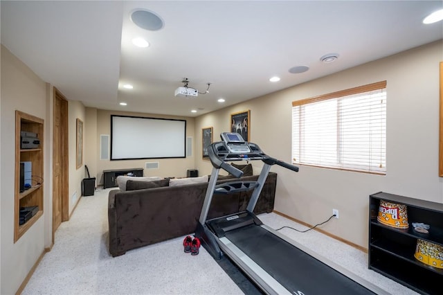 exercise area featuring light colored carpet