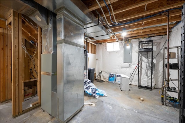 basement featuring electric panel and heating unit