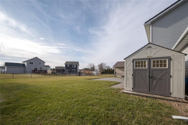 view of yard with a storage unit