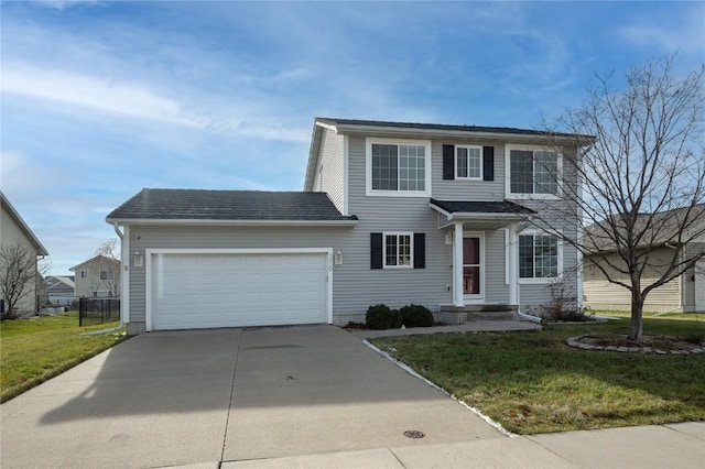 view of front of home with a front yard and a garage