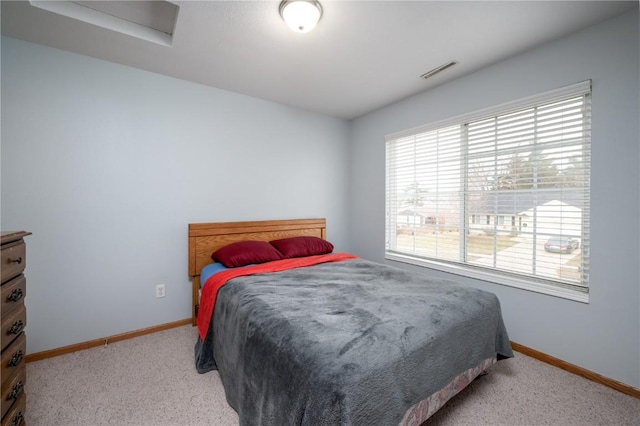 bedroom with light colored carpet