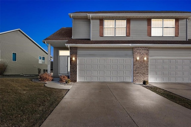 view of front of house with a front yard and a garage