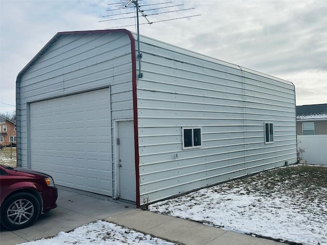 view of snow covered garage