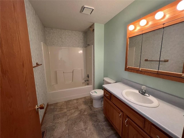 full bathroom with toilet, bathtub / shower combination, and vanity