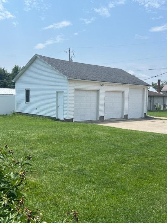 garage with a lawn