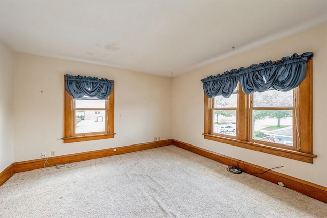 spare room featuring carpet floors