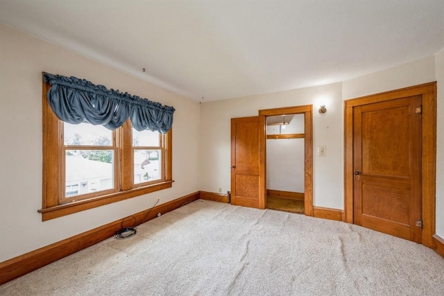 unfurnished bedroom featuring light colored carpet