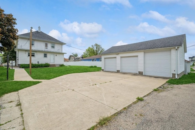 view of home's exterior featuring a garage and a lawn