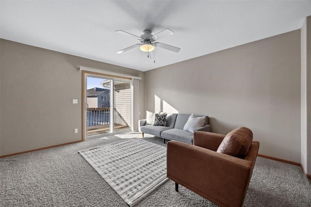 carpeted living room featuring ceiling fan