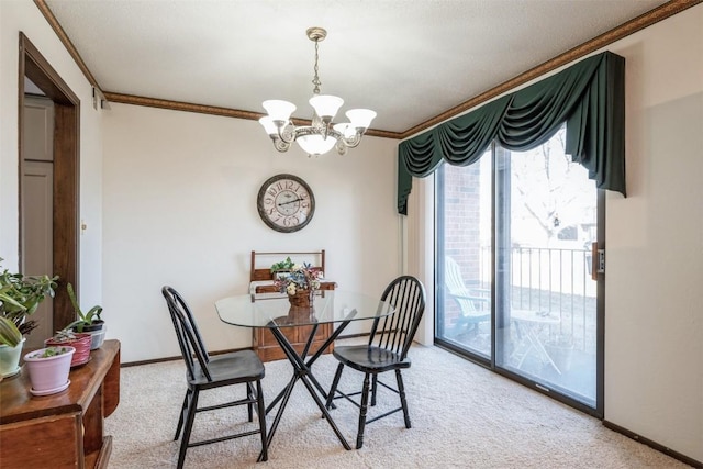 dining room featuring carpet floors, ornamental molding, and a chandelier