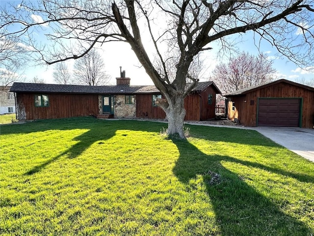 145 Fairway Dr, Lisbon, IA 52253 - view of front of property with an attached garage, a chimney, driveway, and a front yard