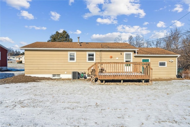 back of house featuring central AC unit and a wooden deck