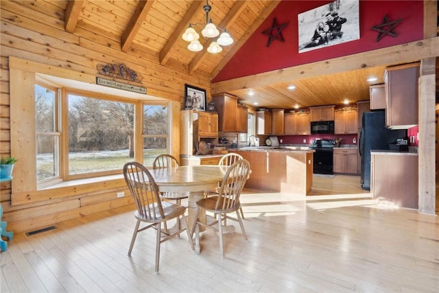 dining space featuring light wood-type flooring, an inviting chandelier, wood ceiling, and high vaulted ceiling