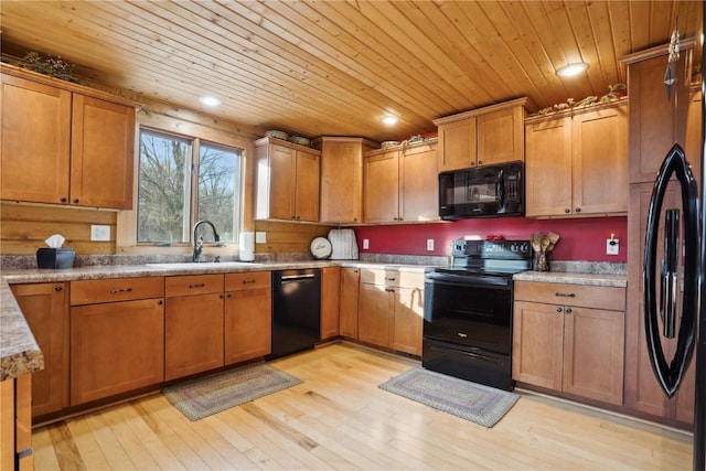 kitchen with sink, light hardwood / wood-style flooring, black appliances, and wooden ceiling