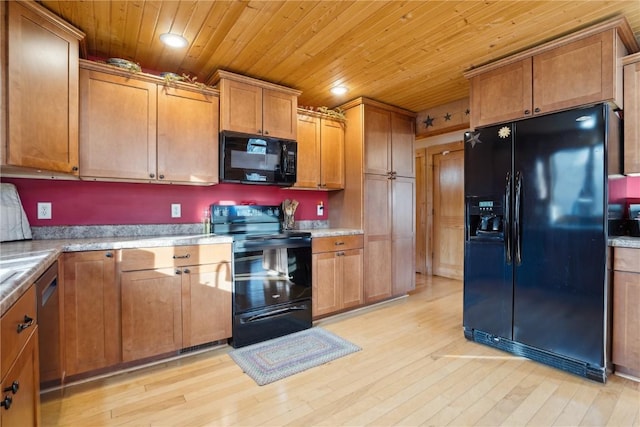 kitchen with wood ceiling, light hardwood / wood-style floors, and black appliances