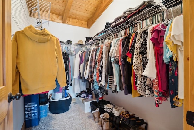 walk in closet featuring carpet flooring and beam ceiling