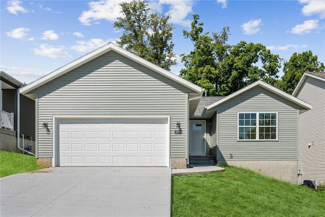 view of front of house featuring a front yard and a garage