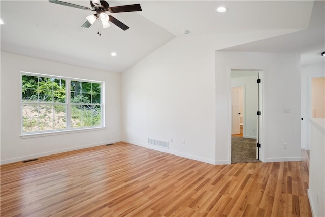 spare room with ceiling fan, light hardwood / wood-style flooring, and lofted ceiling