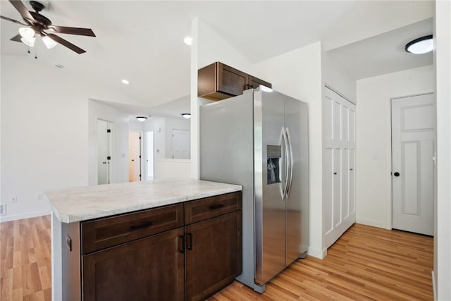 kitchen featuring light wood-type flooring, dark brown cabinets, stainless steel fridge with ice dispenser, and kitchen peninsula