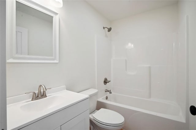 full bathroom featuring bathtub / shower combination, vanity, and toilet