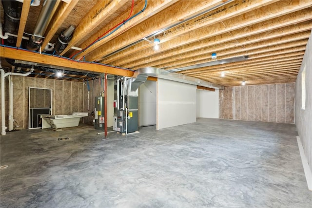 basement with heating unit and water heater