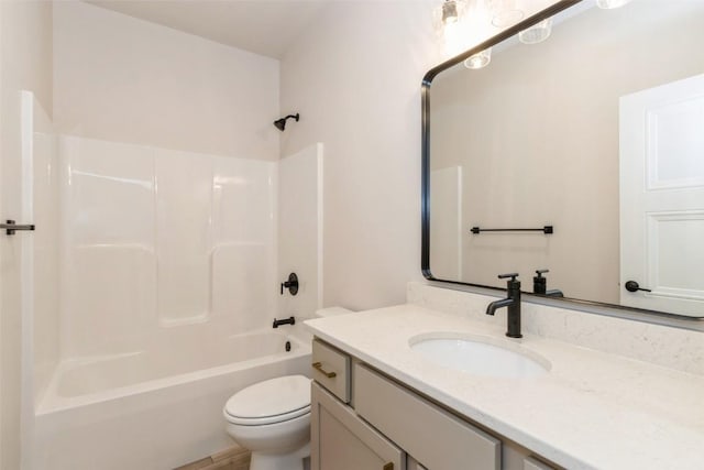 full bathroom with washtub / shower combination, vanity, and toilet