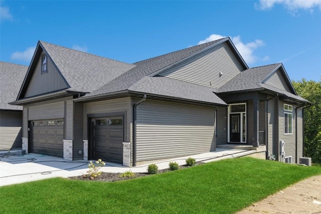 view of front of home featuring a front yard and cooling unit