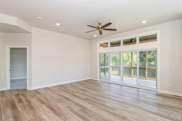 spare room featuring ceiling fan and light hardwood / wood-style flooring