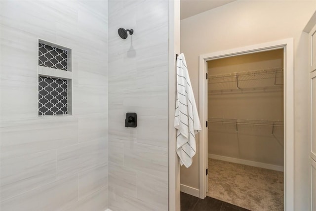 bathroom with a tile shower