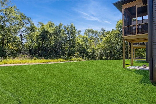 view of yard with a sunroom