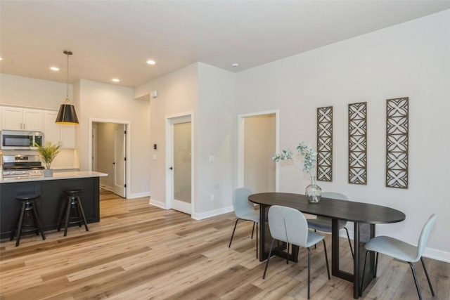 dining room with light hardwood / wood-style flooring