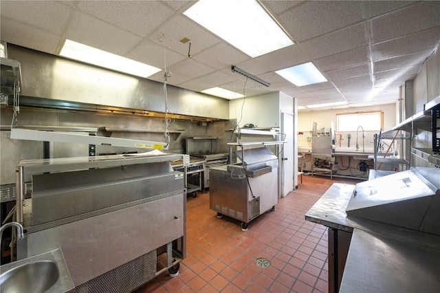 kitchen with a drop ceiling and sink