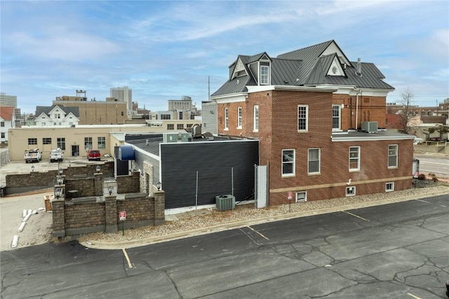 view of home's exterior with cooling unit