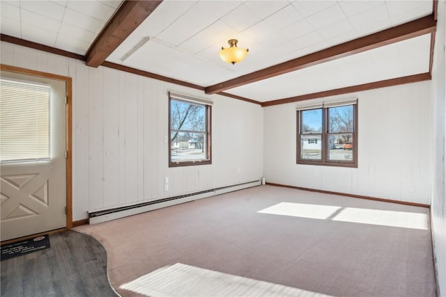 interior space featuring beam ceiling, a baseboard radiator, and hardwood / wood-style flooring