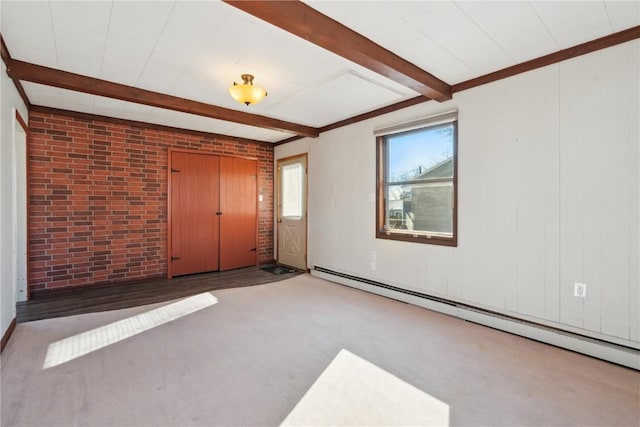 unfurnished room featuring beam ceiling, baseboard heating, brick wall, and carpet flooring