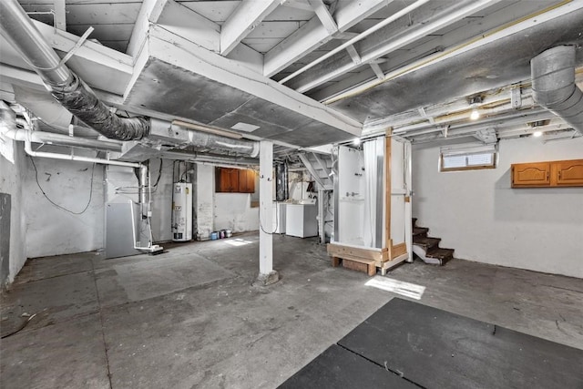 basement featuring washer / clothes dryer and gas water heater