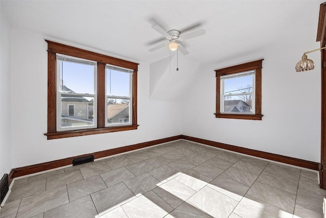 additional living space featuring light tile patterned flooring and ceiling fan