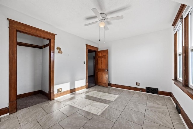 unfurnished bedroom with ceiling fan