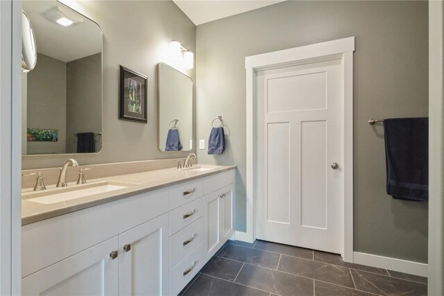 bathroom featuring tile patterned flooring and vanity