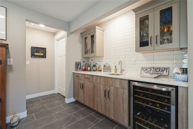 bar with sink, backsplash, and wine cooler