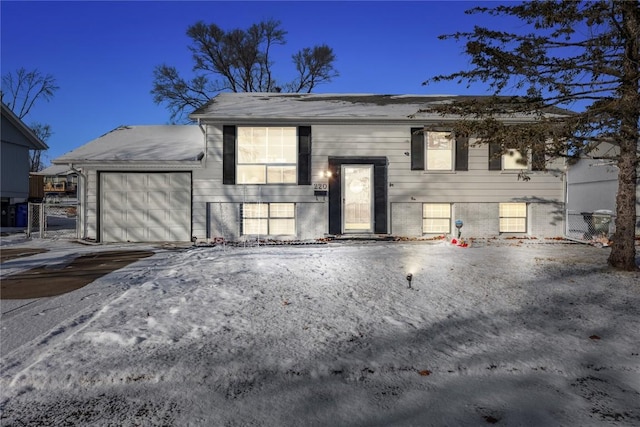 raised ranch featuring a garage