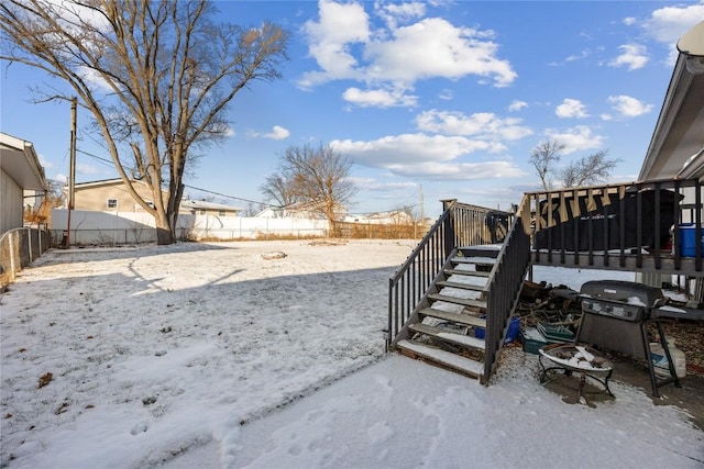 view of yard layered in snow