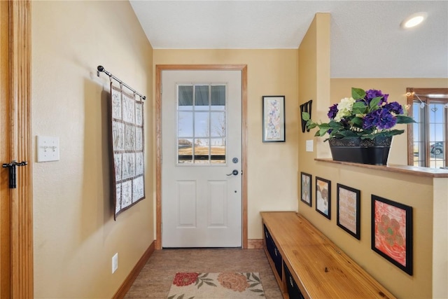 doorway to outside featuring plenty of natural light