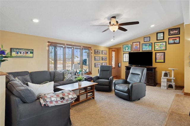 carpeted living room featuring ceiling fan and vaulted ceiling