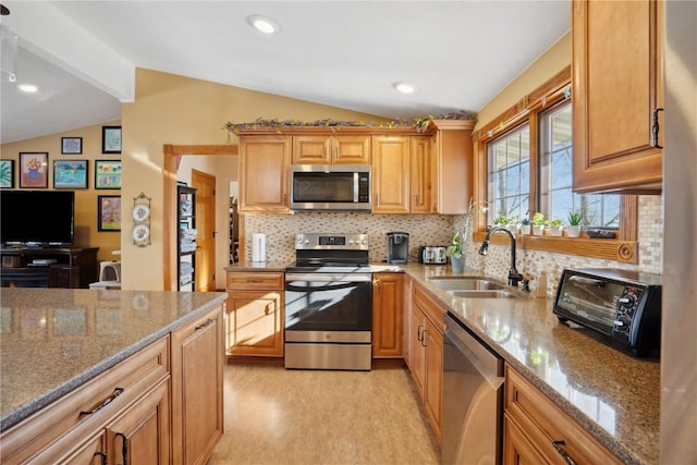 kitchen with appliances with stainless steel finishes, vaulted ceiling with beams, light stone counters, sink, and backsplash