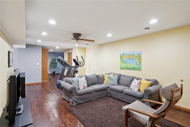 living room with ceiling fan and dark hardwood / wood-style floors