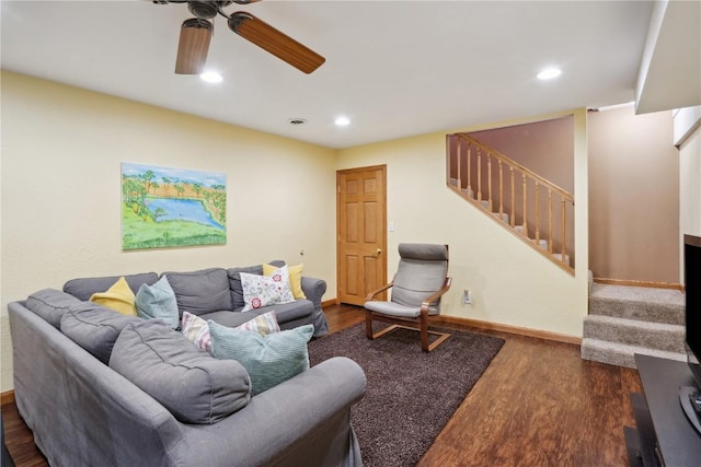 living room featuring ceiling fan and wood-type flooring