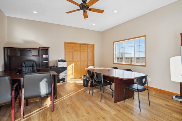 office space with ceiling fan and light hardwood / wood-style flooring